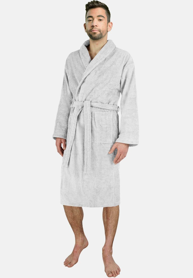 Gray, soft terry cloth bathrobe with long sleeves, belted waist, and a patch pocket. Model stands barefoot, showcasing robe length.