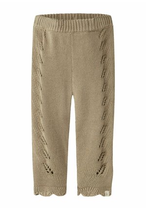 Pantalon bébé beige en maille avec taille côtelée et motifs ajourés décoratifs courant verticalement sur les deux jambes.