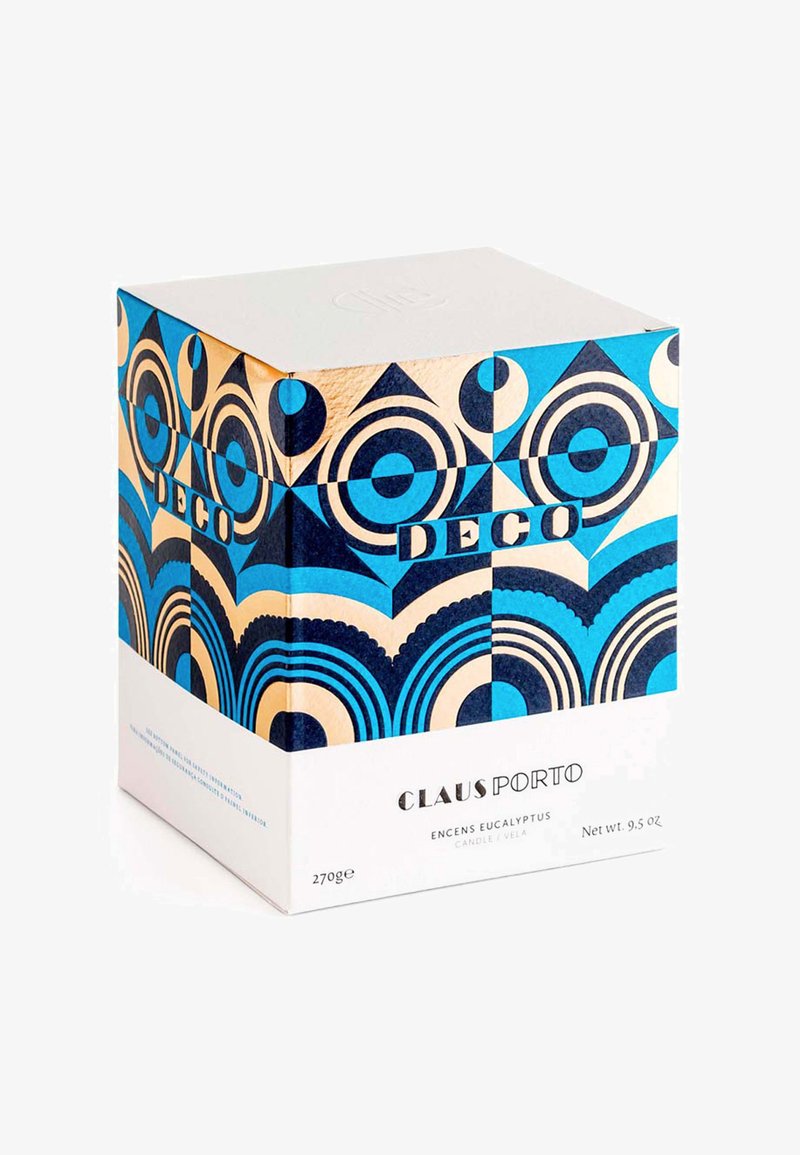 Die quadratische Verpackung weist ein geometrisches Design in Blau und Gold auf, mit kreisförmigen Mustern und auffälliger Schrift auf einem weißen Hintergrund.