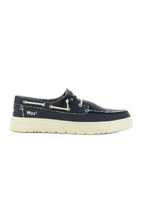 Scarpe in tela blu navy con rifiniture bianche, punta rotonda e suola in gomma. Presentano cuciture decorative e occhielli metallici per i lacci. Nome del marchio visibile.