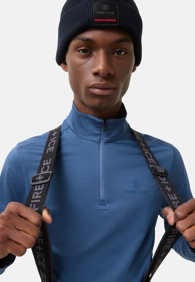 Niebieska bluza z suwakiem do ćwiartki, o gładkiej fakturze, z subtelnym logo oraz regulowanymi czarnymi paskami z marką "FIRE + ICE".