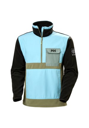 Fleece pullover in light blue and black with a zip neck, featuring a green panel and a chest pocket with a flap. Logo on sleeve.