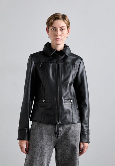 Black leather jacket with a high collar, front zipper, and two front pockets. Features subtle stitching and a fitted design.