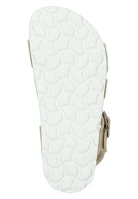 Suela de sandalia con una superficie de goma blanca texturizada que presenta un patrón circular. El costado tiene una correa marrón con una hebilla de metal para el ajuste.