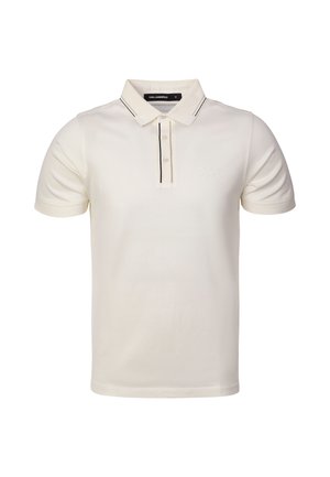 Polo blanco de manga corta con cuello, tapeta de dos botones, detalles en negro y logo sutil en el pecho izquierdo.
