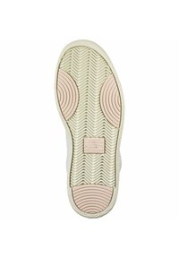 Podeszwa buta w jasnym kremie z teksturowanymi wzorami w zygzaku. Posiada okrągłe akcenty w jasnoróżowym kolorze oraz centralne logo oznaczone napisem "PUMA."
