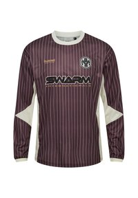 Langærmet lilla sportstrøje med tynde hvide lodrette striber, hvid krave og sidepaneler, "SWARM"-logo og en rund holdemblem på brystet.