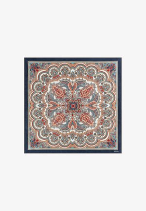 Square rug with intricate paisley pattern in red, blue, and cream. Features scalloped edges and a dark blue border. Textured surface.