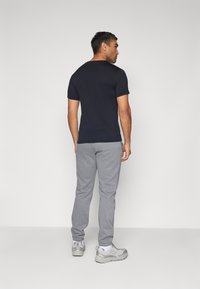 Columbia MERIDIAN CREEK™ JOGGER - Spodnji deli trenirk - city grey heather