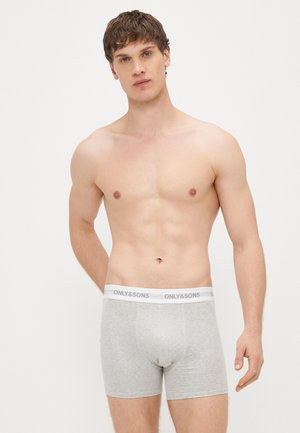 Grijze katoenen boxershorts met een witte elastische tailleband waarop de tekst "ONLY & SONS" staat. De pasvorm is strak met een gladde textuur.
