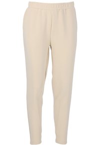 Beiga stretchbyxor med elastisk midja, avsmalnande design, mjuk textur och vertikala sömmar längs benen.