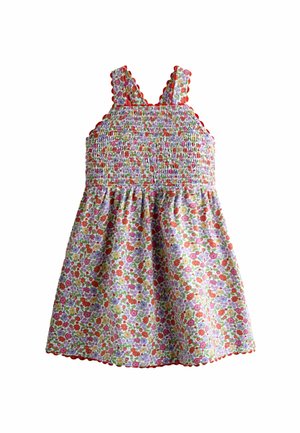 Ärmelloses Kleid für Kleinkinder mit gerafftem Oberteil, mehrfarbigem Blumenmuster und orangefarbenem Bommelbesatz an Trägern und Saum.