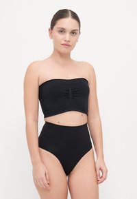 Black two-piece swimwear featuring a strapless top with front gathering and high-waisted bottoms. Smooth, stretchy fabric with a solid color.