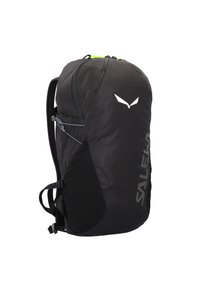 Schwarzer Rucksack mit strukturiertem Oberflächen, limegrünen Reißverschluss-Zippern, weißem Logo und verstellbaren Trägern. Seitentasche für zusätzlichen Stauraum.