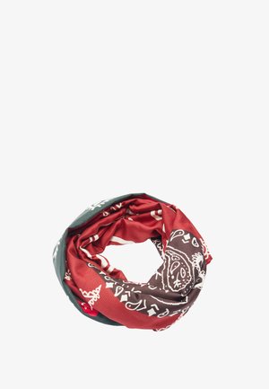 Wielokolorowa chusta z tkaniny złożona w kształt koła z czerwonymi, brązowymi i zielonymi sekcjami z białymi wzorami paisley.