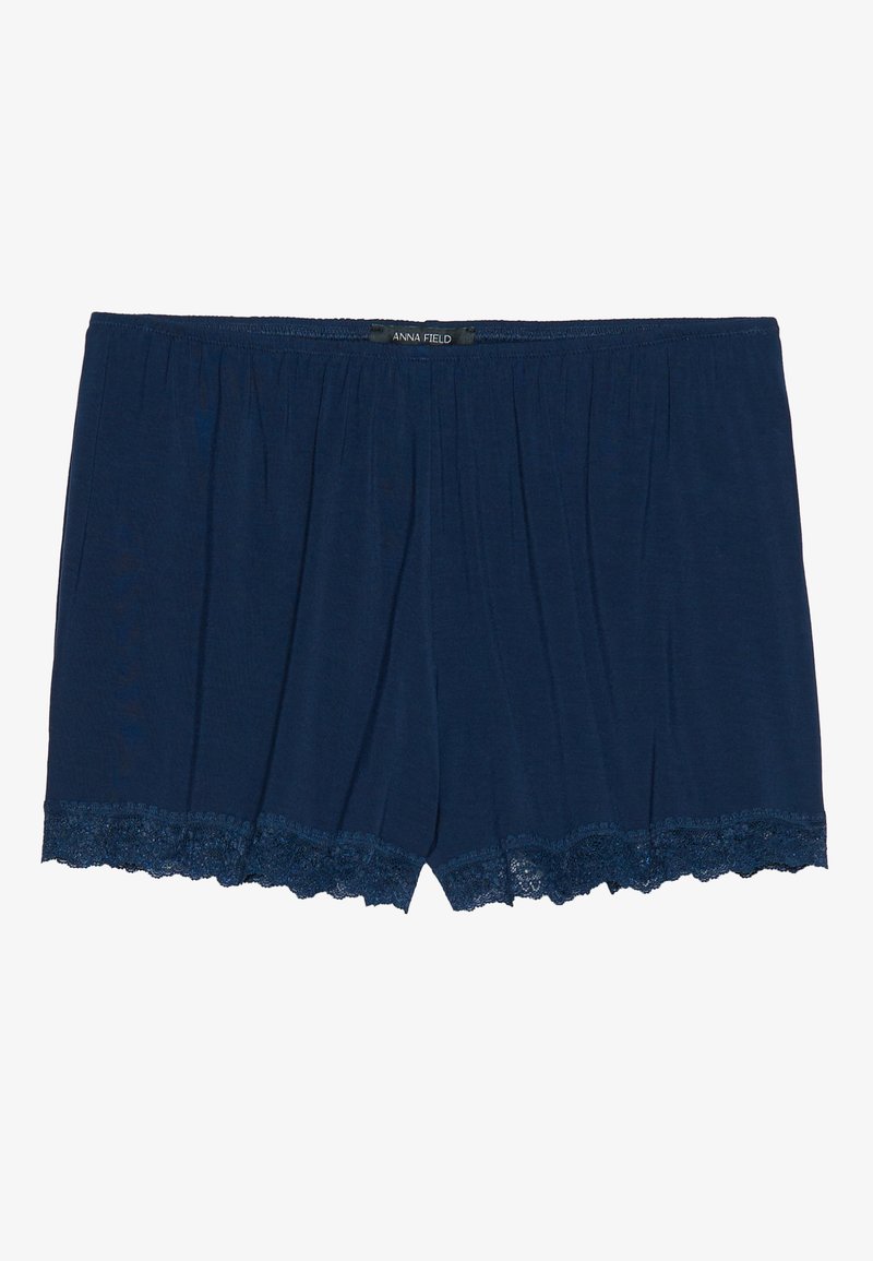 Shorts bleu marine en tissu doux, avec une finition en dentelle à l'ourlet et une taille élastique avec des petites fronces. Marque : Anna Field.