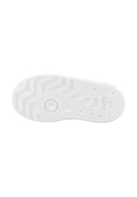 Semelle de chaussure blanche avec des motifs de traction circulaires et en zigzag, présentant le logo Puma et marquée comme non-rayante.