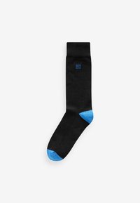 Black sock made of soft fabric with a blue toe and heel. Small blue logo featured on the cuff. Classic crew length design.