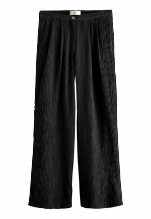 Schwarze, plissierte Schlaghosen aus einem strukturierten Stoff. Mit einem Knopfverschluss an der Taille und einer lässigen Silhouette.