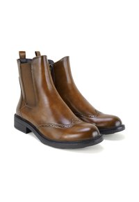 Braune Leder-Ankle-Boots mit elastischen Seiteneinsätzen, dekorativer Brogue-Verzierung, abgerundeter Zehenpartie und niedrigem Blockabsatz. Geschmeidige Textur.