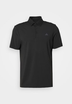 Black polo shirt made from smooth fabric with a buttoned collar. Features a subtle logo on the left chest and short sleeves.