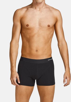Schwarze Baumwollboxer mit einem weichen, elastischen Bund, auf dem der Markenname steht. Klassisches Design mit einer figurnahen Form und minimalen Nahtdetails.