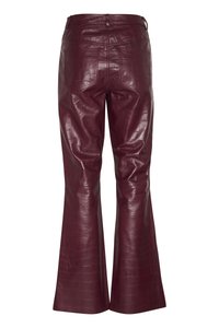 Burgundy faux leather flared pants with a crocodile texture, featuring two back pockets and belt loops, designed for a fitted silhouette.