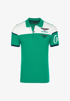 Rohelise ja valgega polo-särk tumesinise äärega, nööbitava kraega, tiivulise embleemiga ning tekstiga "CARISMA" ja "East to West Racing Team".