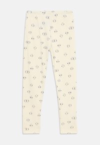 Cream-colored leggings with an elastic waistband and a scattered pattern of small black-and-white panda faces.