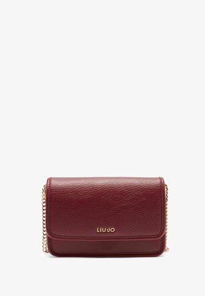 Burgundy faux leather crossbody bag with a chain strap, featuring a gold logo and smooth texture, rectangular shape with fold-over flap.