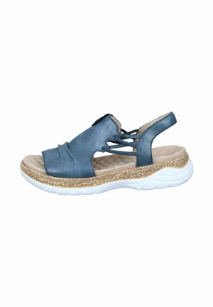 Blaue Leder-Sandale mit offener Zehe, elastischen Kreuzriemen, gepolstertem Fußbett und einer strukturierten Kork-Optik auf einer weißen Gummisohle.