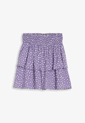 Lila Rock mit weißem unregelmäßigem Punktmuster, gerafftem elastischem Bund und mehrschichtigem Rüschendesign.