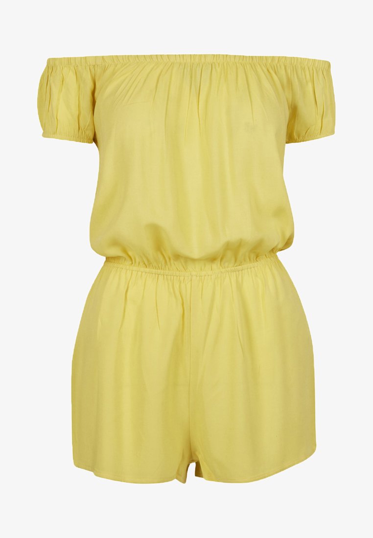 Kollane rinnahoidjaga kombekas, mis on valmistatud kerge kangaga. Omab paksu varrukat, elastset vööd ja lühikesi, vabalt langevaid lühikesi pükse.