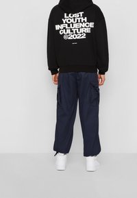 Lost Youth Jersey con capucha - black