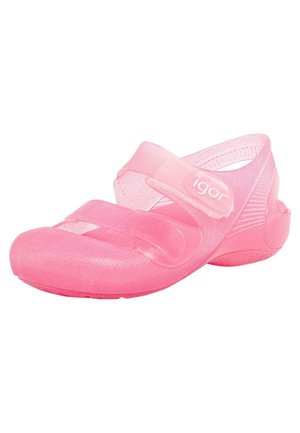 Translucent pink plastic shoe with a rounded toe, adjustable straps, and textured surface. Lightweight design for easy wear and comfort.