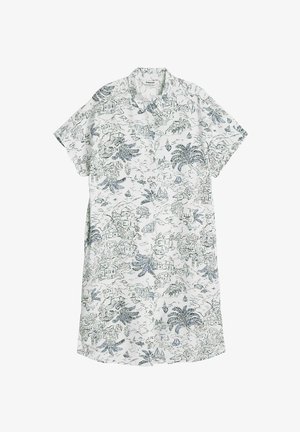 Kortärmad skjorta i vitt tyg med ett detaljerat mönster av grön- och blånyanser som föreställer landskap med hus, fartyg och växtlighet.