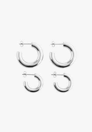 Set of four silver hoop earrings in varying sizes, featuring a smooth, polished finish and post-back fastenings. Different diameters included.