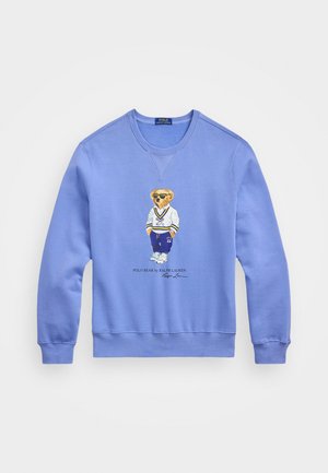 Sudadera azul con un oso bordado que lleva gafas de sol y ropa deportiva, con puños y dobladillo acanalados, fabricada con suave tela de algodón.