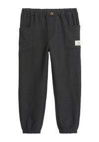 Mörkgrå joggingbyxor i ribbat tyg, med elastiskt midjeband, två sidofickor och en liten etikett på framsidan.