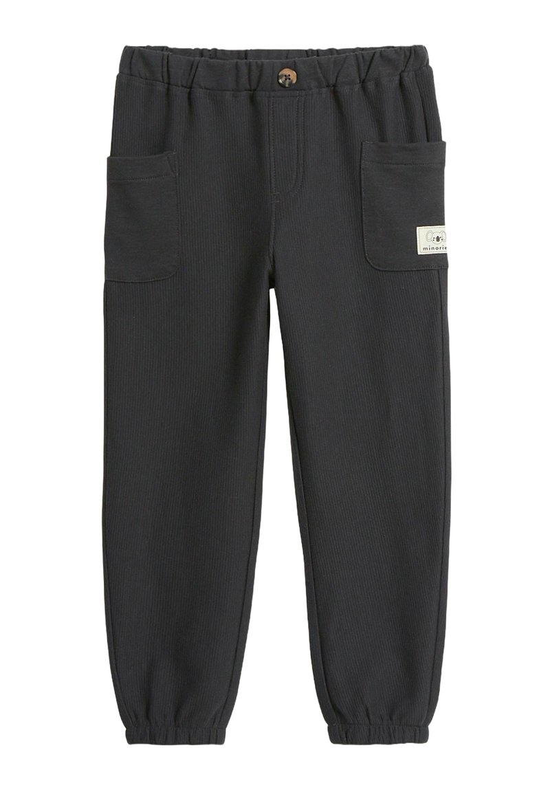 Mörkgrå joggingbyxor i ribbat tyg, med elastiskt midjeband, två sidofickor och en liten etikett på framsidan.