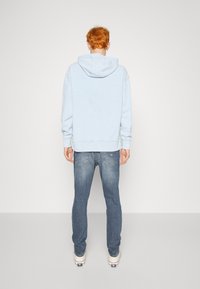 Tommy Jeans AUSTIN SLIM - Tapered-Farkut - denim dark