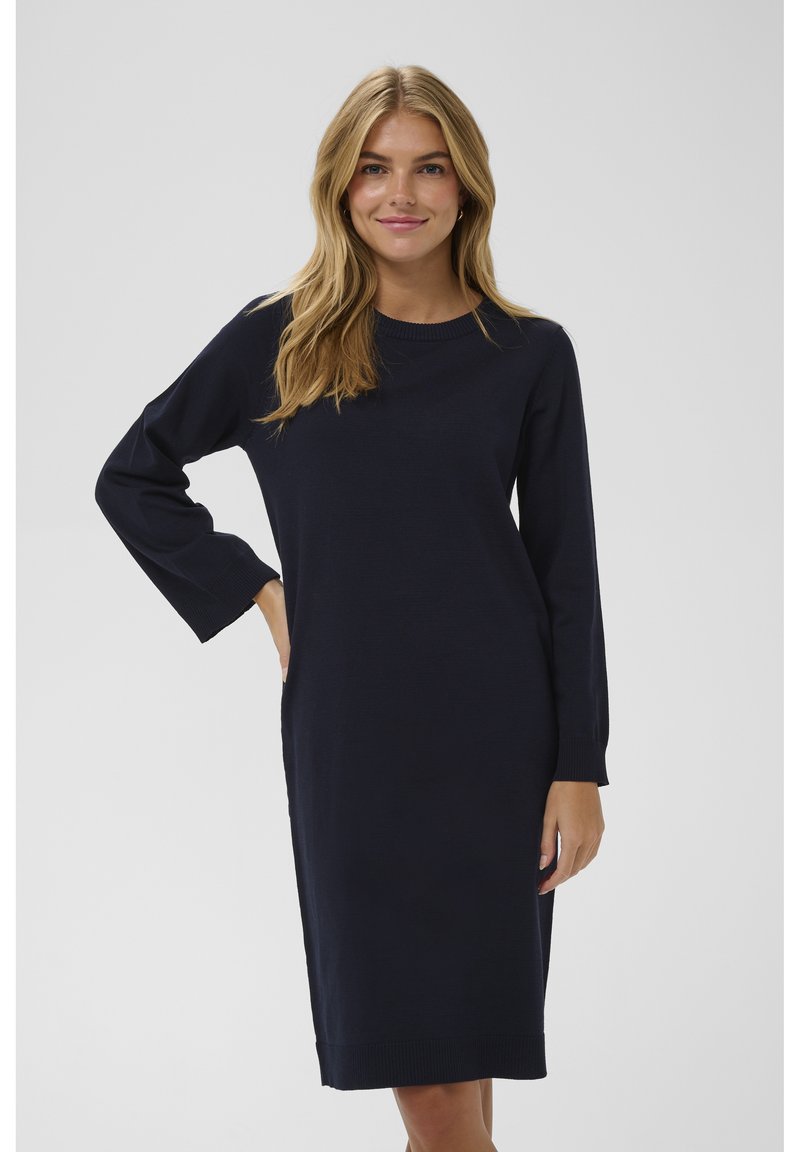 Robe marine à manches longues avec encolure ras du cou, fabriquée en tissu doux, avec des poignets et un bas côtelés ; coupe droite.