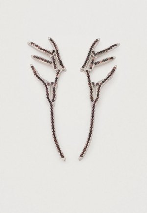 Silver-tone earrings designed in the shape of hands, adorned with black and burgundy gemstones, featuring intricate detailing and fine lines.