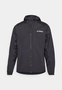 Jachetă neagră Terrex cu glugă, închidere cu fermoar și mâneci cu model. Fabricată dintr-un material ușor, cu manșete elastice și tiv drept.