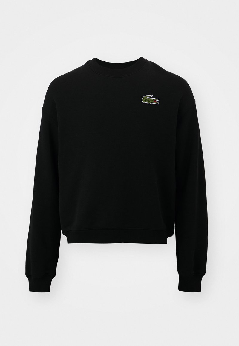 Sweat-shirt noir à manches longues avec col rond et petit logo crocodile vert brodé sur la poitrine gauche.