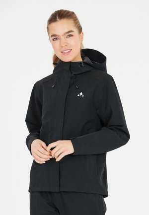 Black waterproof jacket with a high collar and adjustable hood. Features zippered pockets and a subtle logo on the chest.