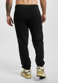 ecko unltd. Tepláky - black