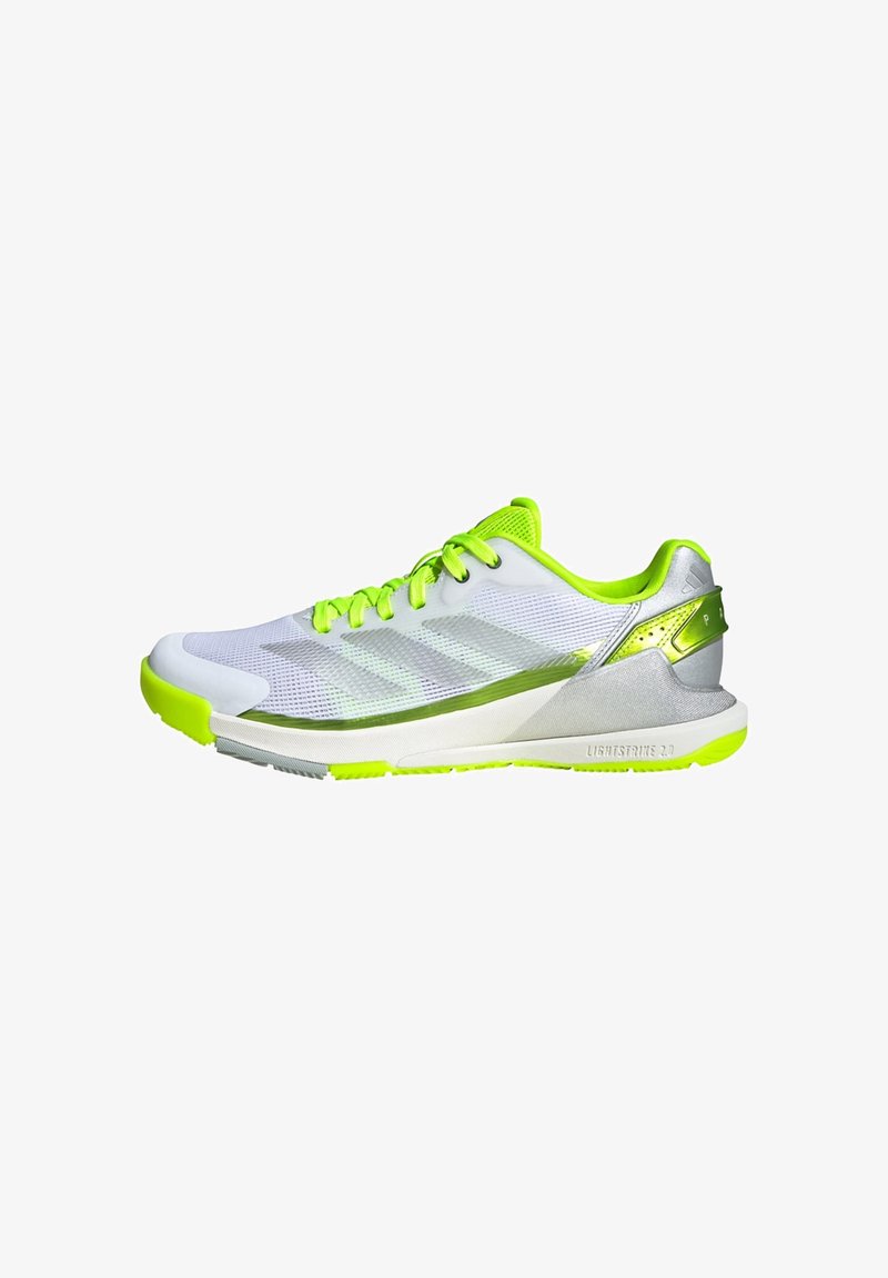White and neon green low-top athletic shoe with mesh upper, lace closure, and cushioned sole marked "Lightstrike 2.0" on the side.