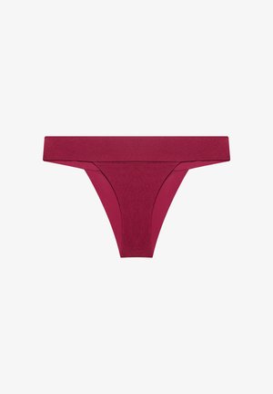 Maroon seamless thong underwear with wide waistband, smooth fabric, and minimal stitching.
