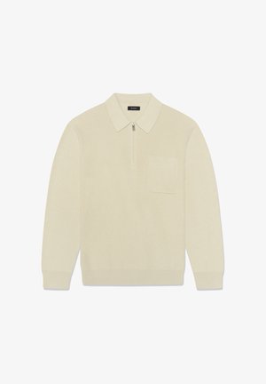 Strickpullover in Off-White mit Reißverschluss am Kragen, langen Ärmeln und einer Brusttasche vorn. Verfügt über eine gerippte Struktur und enganliegende Bündchen.